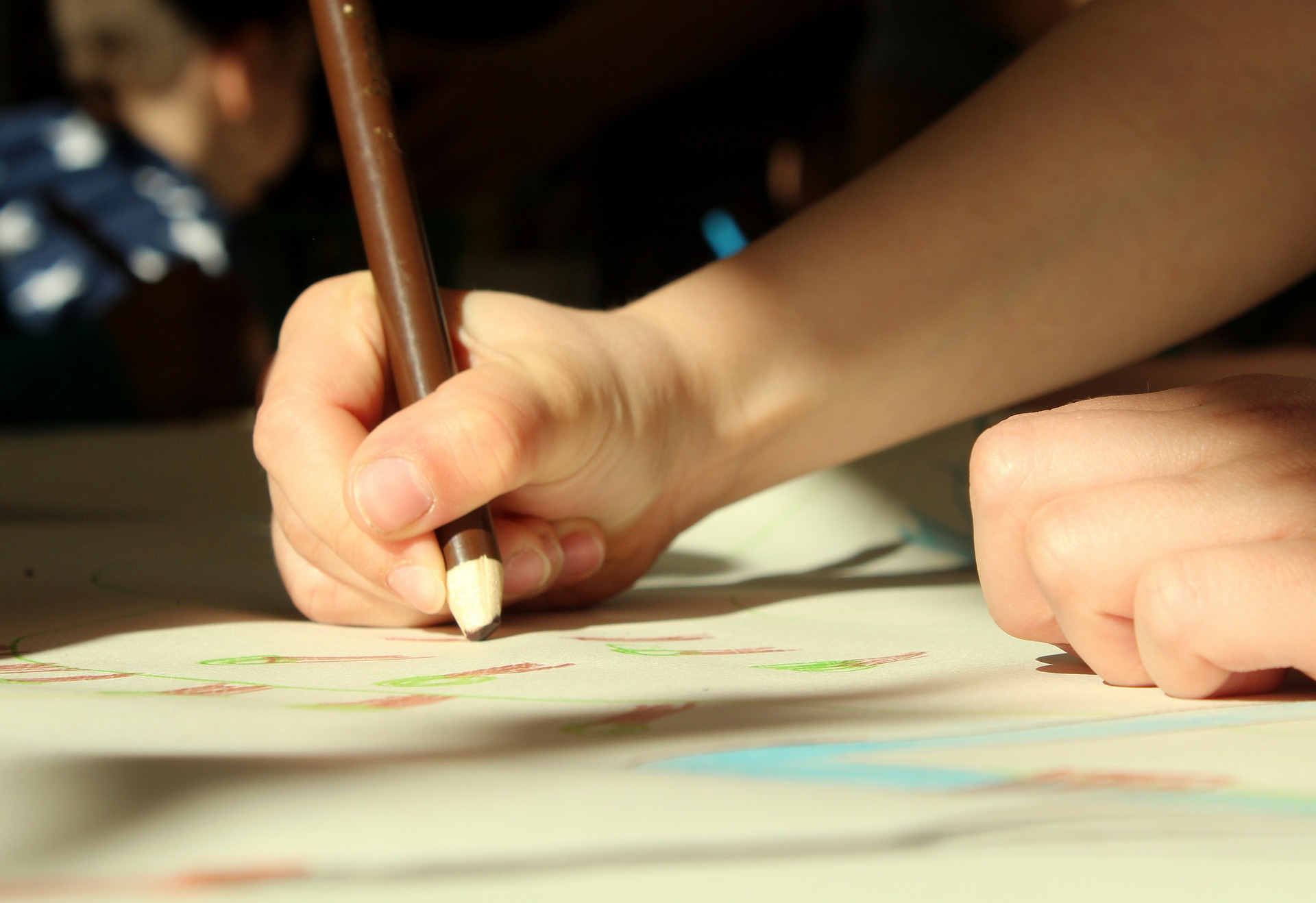 child with brown crayon